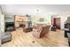 Living room with fireplace, hardwood floors, and comfy seating at 10249 Nw 21St St, Ocala, FL 34482