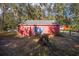 Red storage barn with a cross painted on the side at 10249 Nw 21St St, Ocala, FL 34482