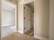 Hallway with view of bedroom featuring carpet and ceiling fan at 11001 Se Sunset Harbor Rd # F45, Summerfield, FL 34491