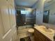 Bathroom with a shower-tub combo, toilet, and vanity sink at 11147 Sw 68Th Ct, Ocala, FL 34476