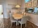 Elegant dining room with chandelier lighting and adjacent to the kitchen at 11147 Sw 68Th Ct, Ocala, FL 34476