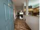 Foyer view showing tile flooring leading to the living room and kitchen with open floorplan at 11147 Sw 68Th Ct, Ocala, FL 34476