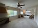 Expansive living area with ceiling fans, neutral carpeting, and ample natural light at 11147 Sw 68Th Ct, Ocala, FL 34476