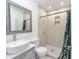 Clean bathroom with a walk-in shower and a modern vanity at 217 Nw 14Th St, Ocala, FL 34475