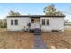 Charming ranch house with a walkway leading to the front entrance at 217 Nw 14Th St, Ocala, FL 34475