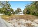 White house with a wide front yard and lush landscaping at 217 Nw 14Th St, Ocala, FL 34475