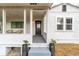 Inviting front porch with a sitting area and string lights at 217 Nw 14Th St, Ocala, FL 34475