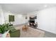 Living room featuring a green sofa and a neutral color scheme at 217 Nw 14Th St, Ocala, FL 34475