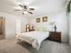 Bedroom with double bed, ensuite bathroom access, and walk-in closet at 2360 Hopespring Loop, The Villages, FL 32162