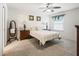 Bright bedroom with double bed and wood furniture at 2360 Hopespring Loop, The Villages, FL 32162