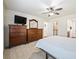 Bedroom with double bed, walk-in closet, and ensuite bathroom at 2360 Hopespring Loop, The Villages, FL 32162