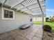 Covered patio with pergola, tile flooring, and grassy backyard at 2360 Hopespring Loop, The Villages, FL 32162