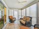 Relaxing sunroom featuring wicker furniture and sliding glass doors at 2360 Hopespring Loop, The Villages, FL 32162