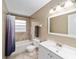 Updated bathroom with tub, vanity, and modern accents at 3720 Se 24Th St, Ocala, FL 34471