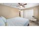 Well-lit bedroom with a queen-size bed and mirrored closet at 3720 Se 24Th St, Ocala, FL 34471