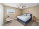 Cozy bedroom with a full-size bed and ceiling fan at 3720 Se 24Th St, Ocala, FL 34471