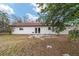 Back exterior of house with patio and yard; great for entertaining at 3720 Se 24Th St, Ocala, FL 34471