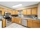 Kitchen with light wood cabinets, stainless steel appliances, and granite countertops at 3720 Se 24Th St, Ocala, FL 34471