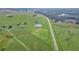 Aerial view of property showing home, pond, and road at 4027 N C 470, Lake Panasoffkee, FL 33538