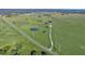 Aerial view showing home, pond, and expansive green acreage at 4027 N C 470, Lake Panasoffkee, FL 33538