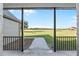 Covered back porch with a view of the expansive backyard and rural landscape at 4027 N C 470, Lake Panasoffkee, FL 33538