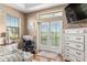 Relaxing bedroom with a view, comfortable seating, and large window at 4027 N C 470, Lake Panasoffkee, FL 33538