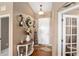 Light and airy entryway with decorative table and mirror at 4027 N C 470, Lake Panasoffkee, FL 33538