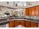 Kitchen with an island, a view into the living room, and stainless steel appliances at 4027 N C 470, Lake Panasoffkee, FL 33538