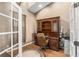 Home office with built-in wooden desk and French doors at 4027 N C 470, Lake Panasoffkee, FL 33538