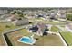 Backyard oasis with a private pool, lounge chairs, and a fenced yard with solar panels on the roof at 4812 Se 37Th St, Ocala, FL 34480