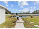 Spacious backyard with a rectangular pool, lounge chairs and neatly arranged landscaping at 4812 Se 37Th St, Ocala, FL 34480