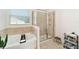 Bathroom featuring a soaking tub, walk-in shower and a window at 4812 Se 37Th St, Ocala, FL 34480