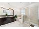 Bathroom with double vanity, soaking tub, and glass-enclosed shower at 4812 Se 37Th St, Ocala, FL 34480