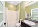 Cozy bathroom featuring a tiled shower with bathtub, toilet, granite countertop, and mirror at 4812 Se 37Th St, Ocala, FL 34480