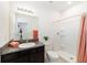 Bathroom featuring a granite countertop, tiled shower, toilet, mirror and decorative elements at 4812 Se 37Th St, Ocala, FL 34480