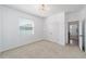 Bedroom with neutral carpet, white walls, a closet, and natural light coming through the window at 4812 Se 37Th St, Ocala, FL 34480