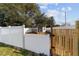 Backyard chicken coop enclosed by white fencing, providing a secure and functional space at 4812 Se 37Th St, Ocala, FL 34480