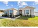 Charming home exterior with lush landscaping, stone accents, neutral paint, and a welcoming walkway at 4812 Se 37Th St, Ocala, FL 34480