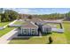 Inviting single-story home featuring manicured landscaping, modern colors, and a well-maintained lawn at 4812 Se 37Th St, Ocala, FL 34480