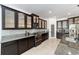 Spacious kitchen with glass door cabinets, stainless steel appliances, granite counters and tile backsplash at 4812 Se 37Th St, Ocala, FL 34480