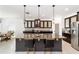 Kitchen with large granite island, pendant lights, stainless steel appliances, and dining area at 4812 Se 37Th St, Ocala, FL 34480