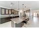 Modern kitchen features a large island, stainless steel appliances, granite countertops and pendant lighting at 4812 Se 37Th St, Ocala, FL 34480