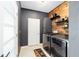 Laundry room with wood wall accents, front-load washer and dryer, and plenty of storage space at 4812 Se 37Th St, Ocala, FL 34480
