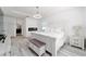 Main bedroom with wood floors, a fireplace, white accents, and en-suite bathroom at 4812 Se 37Th St, Ocala, FL 34480