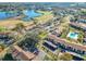 Community aerial view, pool, and lake at 506 Fairways Cir # B, Ocala, FL 34472