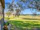 Landscaped backyard with golf course views at 506 Fairways Cir # B, Ocala, FL 34472