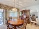 Bright dining room with wood table and chandelier at 506 Fairways Cir # B, Ocala, FL 34472