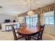 Dining room features a wood table and access to a patio at 506 Fairways Cir # B, Ocala, FL 34472