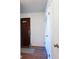 Condo entryway with wood floors and white walls at 506 Fairways Cir # B, Ocala, FL 34472