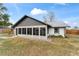 House exterior showcasing a screened-in porch at 6292 Se 87Th St, Ocala, FL 34472